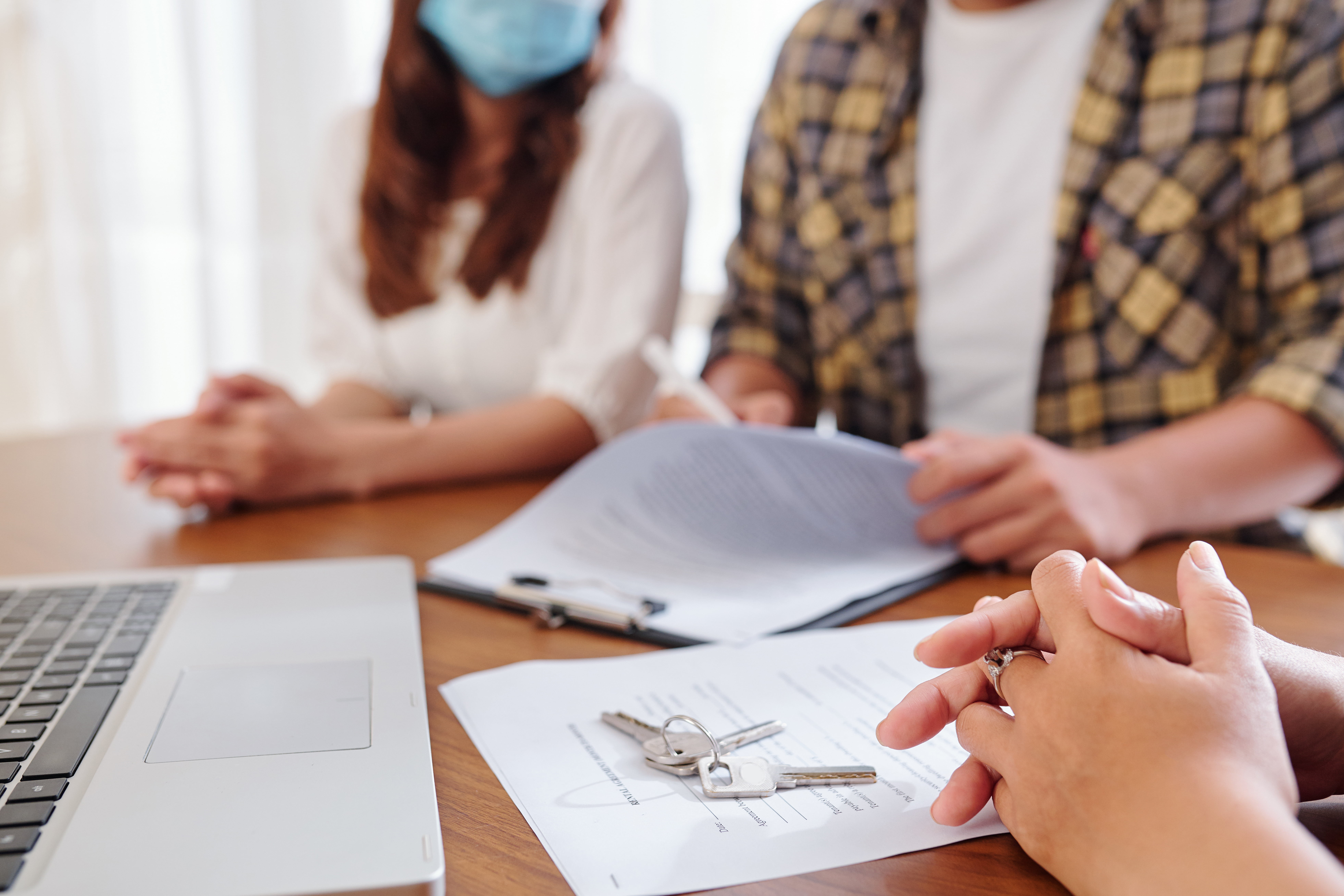Couple meeting with real estate agent